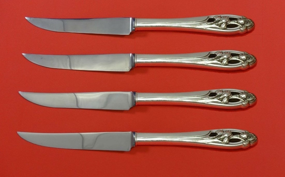 International Silver Silver Iris 4pc Sterling Silver Steak Knife Set: International Silver Silver Iris 4pc Sterling Silver Steak Knife Set Enhance your dining experience with this exquisite 4-piece steak knife set from the Silver Iris pattern by International Silver. Cr