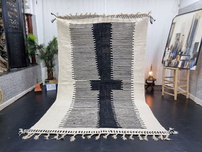 Authentic Handwoven White and Black Rug from Morocco 8 x 5 Feet: Authentic Handwoven White and Black Rug from Morocco 8 x 5 Feet This authentic White & Black Rug is handwoven in the stunning Atlas Mountains by skilled local Berber women weavers. Crafted using tradi