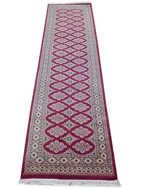 Handcrafted 2'8" x 8'11" Pinkish Red Jaldar Bokhara Rug from Pakistan: Handcrafted 2'8" x 8'11" Pinkish Red Jaldar Bokhara Rug from Pakistan Free continental US Shipping Introduce a touch of timeless elegance to your home with this exquisite 2' 8" x 8' 11" pinkish-red Ja
