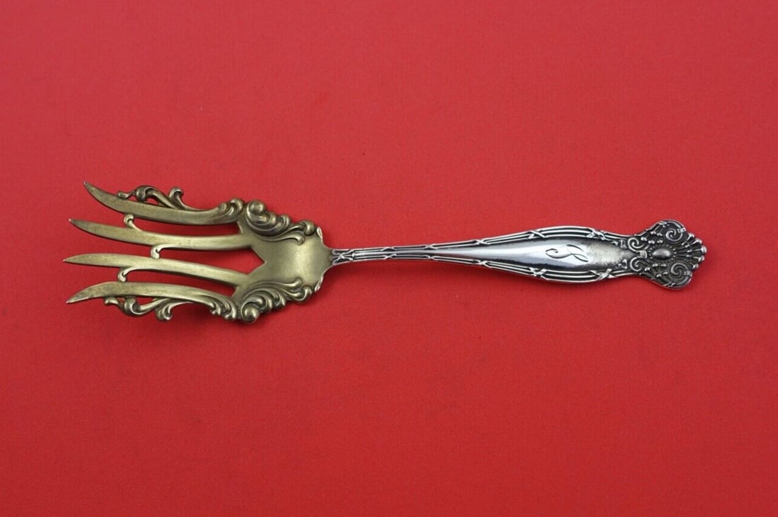 Towle Empire Sterling Silver Cold Meat Fork Gold Wash 6 1/4": Towle Empire Sterling Silver Cold Meat Fork Gold Wash 6 1/4" This exquisite small cold meat fork from the Empire pattern by Towle is crafted from sterling silver and features a gold wash finish. Measu