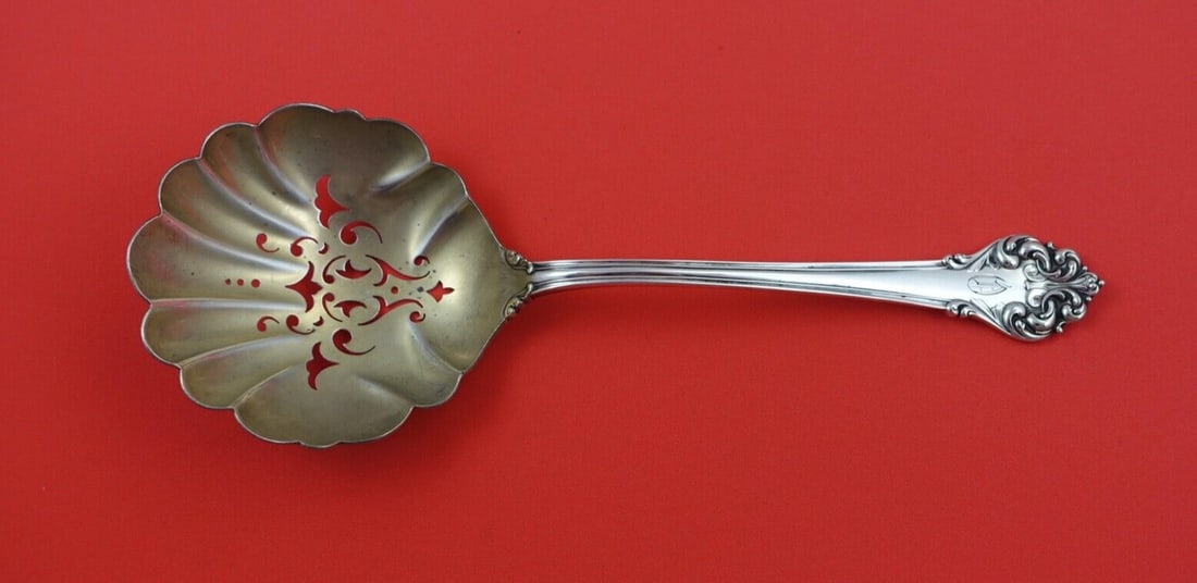 Reed & Barton Elegante Sterling Silver Pierced Pea Spoon 9": Reed & Barton Elegante Sterling Silver Pierced Pea Spoon 9" This elegant pea spoon from Reed and Barton features the exquisite Elegante pattern, also known as L'elegante. Crafted from high-quality ste