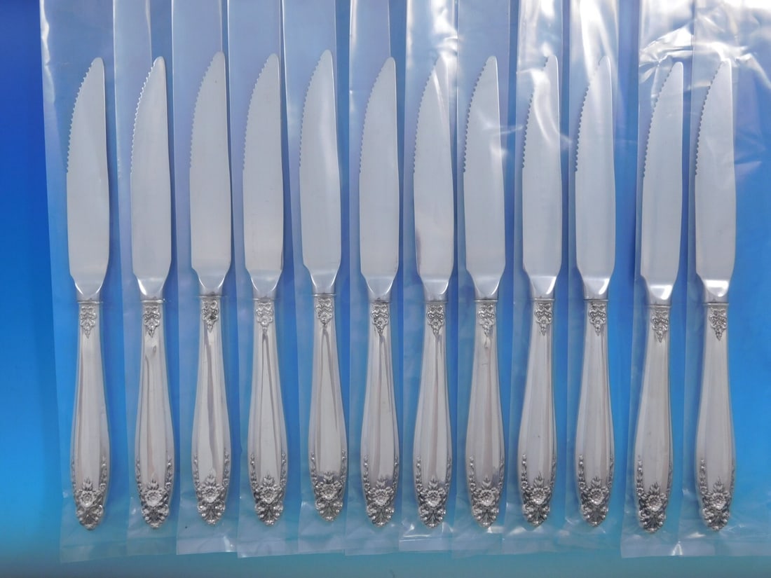 International Prelude Sterling Silver Steak Knife Set 12 pcs: International Prelude Sterling Silver Steak Knife Set 12 pcs Enhance your dining experience with this exquisite set of 12 Prelude steak knives by International. Each knife features a beautifully craft