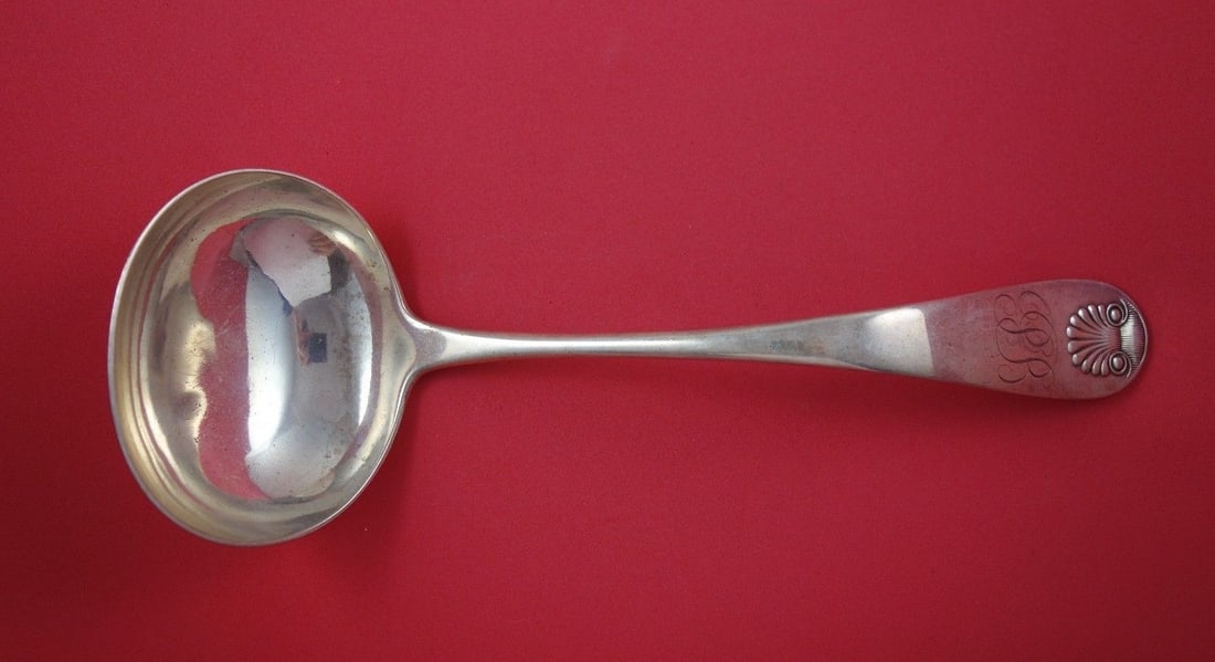Durgin Shell Pattern Sterling Silver Oyster Ladle 10 1/8": Durgin Shell Pattern Sterling Silver Oyster Ladle 10 1/8" This exquisite oyster ladle from the renowned Durgin brand features a beautiful Shell pattern and is crafted from high-quality sterling silver