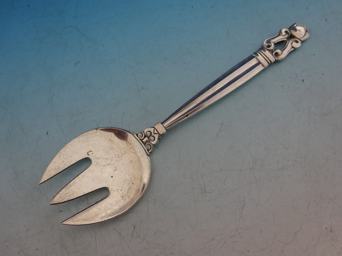 Georg Jensen Acorn Sterling Silver Sardine Fork 5.5 Inch 3-Tine: Georg Jensen Acorn Sterling Silver Sardine Fork 5.5 Inch 3-Tine Discover the elegance of the Acorn pattern serving fork by Georg Jensen, crafted in high-quality sterling silver. This 5 1/2" sardine fo