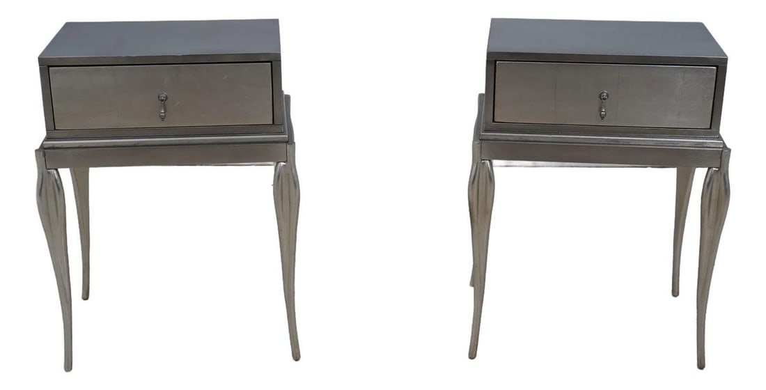 Hollywood Regency Pair of Silverleaf Nightstands with Dovetailed Drawers: Hollywood Regency Pair of Silverleaf Nightstands with Dovetailed Drawers This exquisite pair of Hollywood Regency nightstands showcases a stunning silver leaf finish, exuding elegance and sophisticati