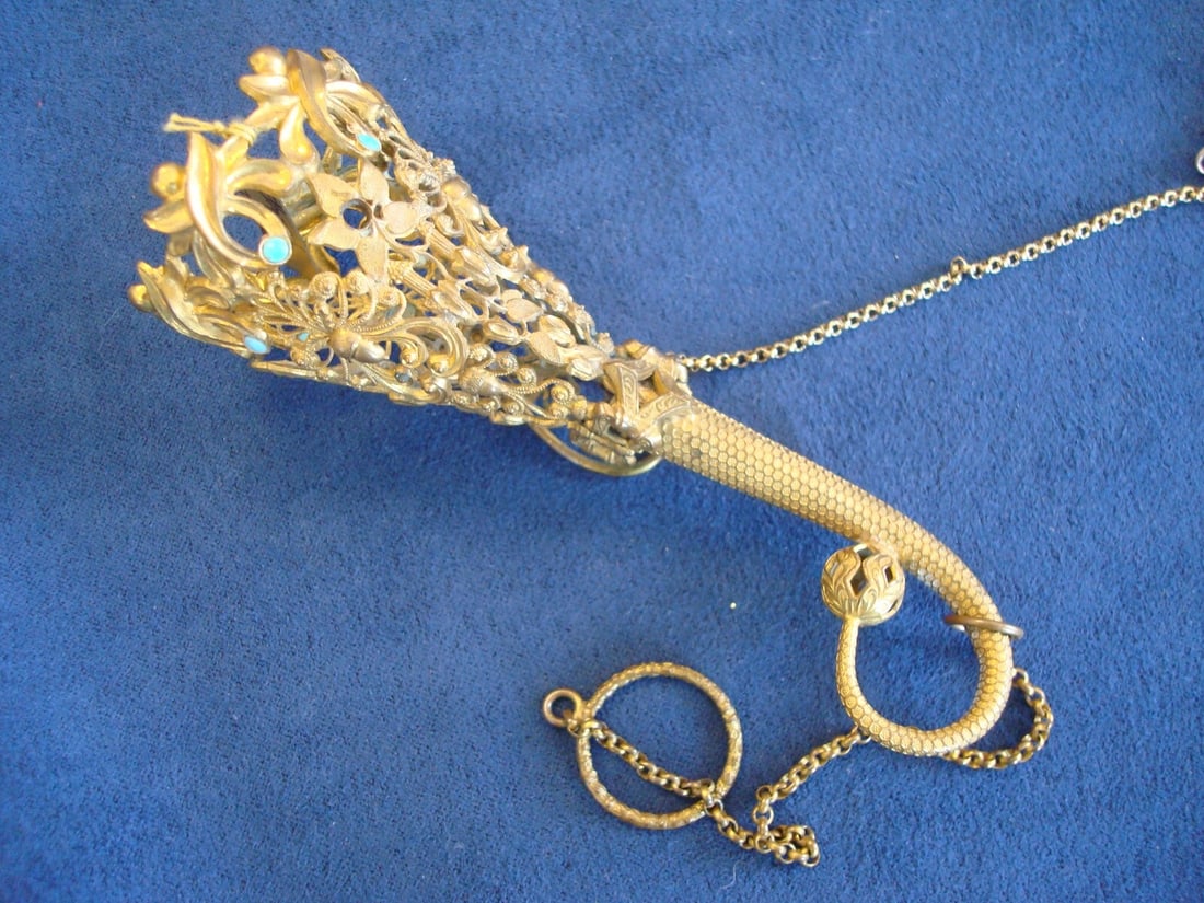 Victorian Gilt Brass Tussie Mussie Holder with 6 Turquoise Cabochons: Victorian Gilt Brass Tussie Mussie Holder with 6 Turquoise Cabochons This exquisite Gilt Brass Tussie Mussie Posey Holder dates back to the Victorian era, specifically from 1880-1890. The holder featu