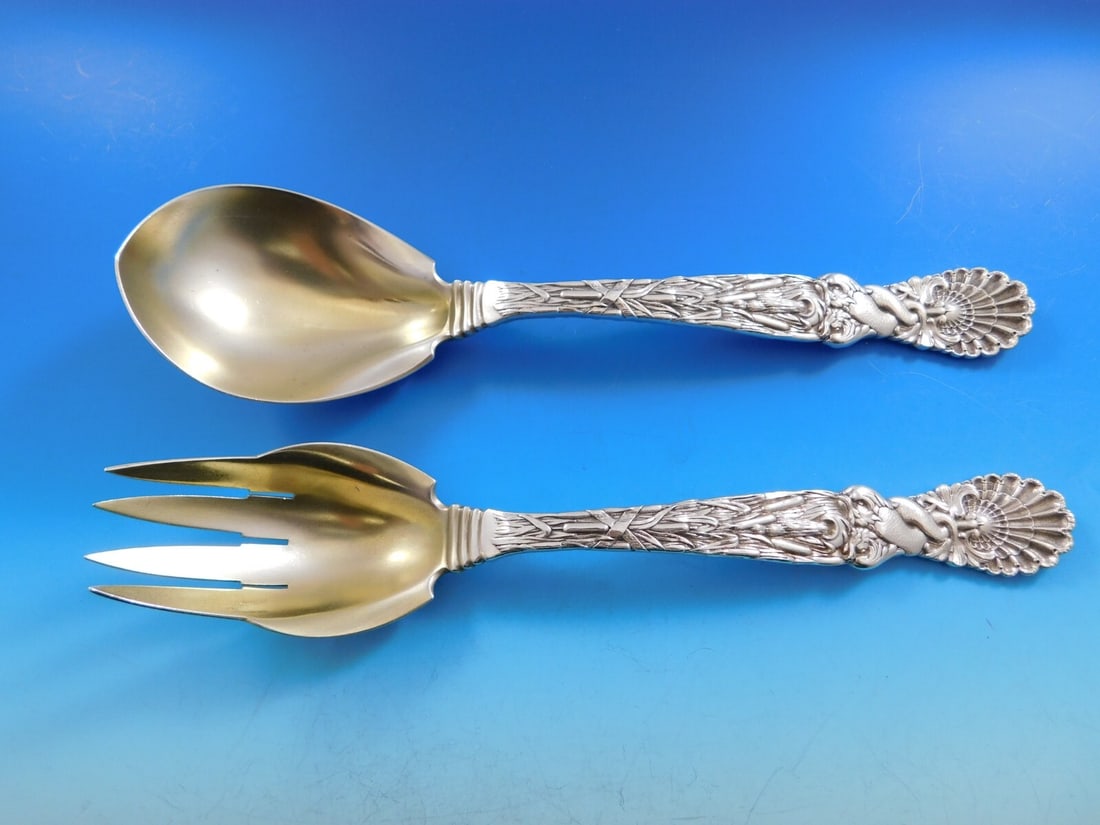 Tiffany & Co Dolphin Sterling Silver Salad Serving Set Gold-Washed 10 1/4": Tiffany & Co Dolphin Sterling Silver Salad Serving Set Gold-Washed 10 1/4" Experience elegance with this exquisite Dolphin salad serving set by Tiffany & Co. Crafted from sterling silver and gold-wash