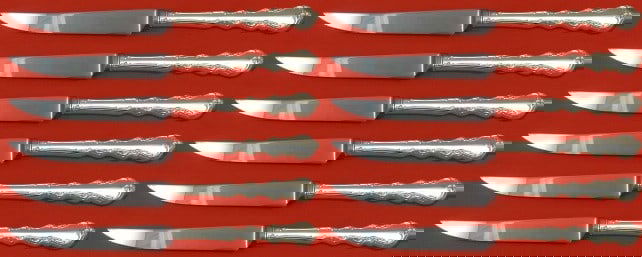 International Silver Angelique Custom Set of 12 Steak Knives 8.5": International Silver Angelique Custom Set of 12 Steak Knives 8.5" This custom set of 12 steak knives features the elegant Angelique pattern by International Silver. Each knife measures 8 1/2" and is c