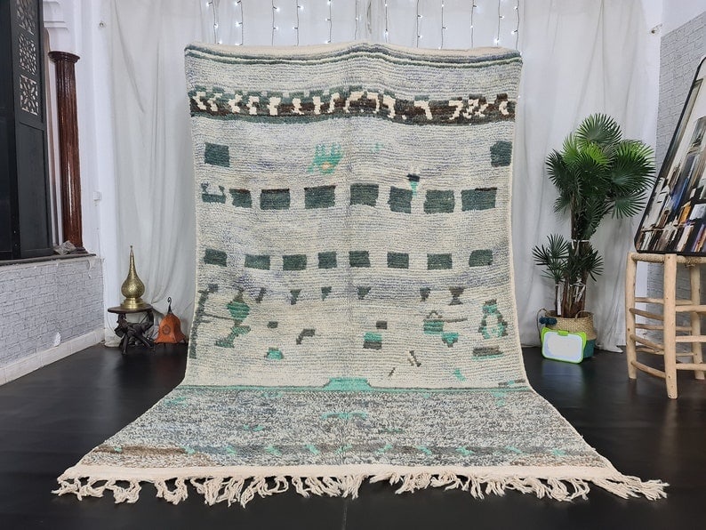 Authentic Moroccan Berber Wool Rug 9.84 x 6.56 Feet: Authentic Moroccan Berber Wool Rug 9.84 x 6.56 Feet Discover the beauty of this Authentic Artistic Handmade Moroccan Berber Wool Rug, meticulously handwoven by skilled Berber women weavers in the Midd