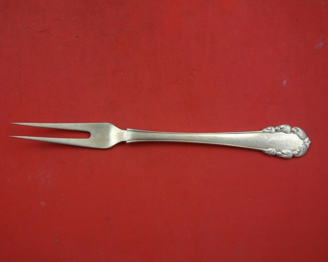 Georg Jensen Lily of the Valley Sterling Silver Serving Fork 6 1/4": Georg Jensen Lily of the Valley Sterling Silver Serving Fork 6 1/4" Enhance your dining experience with this exquisite serving fork from Georg Jensen, featuring the elegant Lily of the Valley pattern.