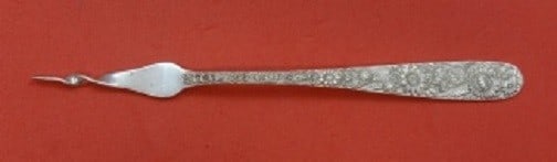 Kirk Repousse Sterling Silver Twisted Butter Pick 6 1/4": Kirk Repousse Sterling Silver Twisted Butter Pick 6 1/4" This elegant butter pick from Kirk showcases the exquisite Repousse pattern, crafted from high-quality sterling silver. Measuring 6 1/4 inches