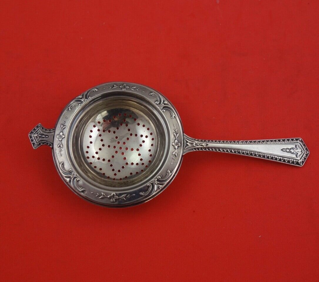 Wallace Number 3239 Sterling Silver Tea Strainer 6 1/8 Inches: Wallace Number 3239 Sterling Silver Tea Strainer 6 1/8 Inches This exquisite tea strainer is crafted from sterling silver and features the classic Number 3239 pattern by Wallace. Measuring 6 1/8 inche