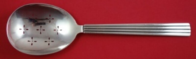 Georg Jensen Bernadotte Sterling Silver Pierced Pea Spoon 9.5": Georg Jensen Bernadotte Sterling Silver Pierced Pea Spoon 9.5" This exquisite Bernadotte pea spoon, crafted by Georg Jensen, showcases a beautiful pierced design and measures 9 1/2 inches in length. M