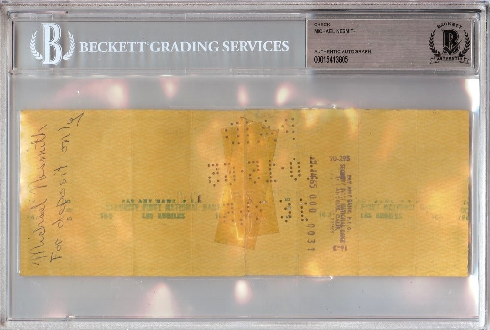 Michael Nesmith Autographed Bank Check Monkees 1965 Beckett Authenticated: Michael Nesmith Autographed Bank Check Monkees 1965 Beckett Authenticated This is an original bank check autographed by Michael Nesmith, a member of the iconic band The Monkees. The check dates back t