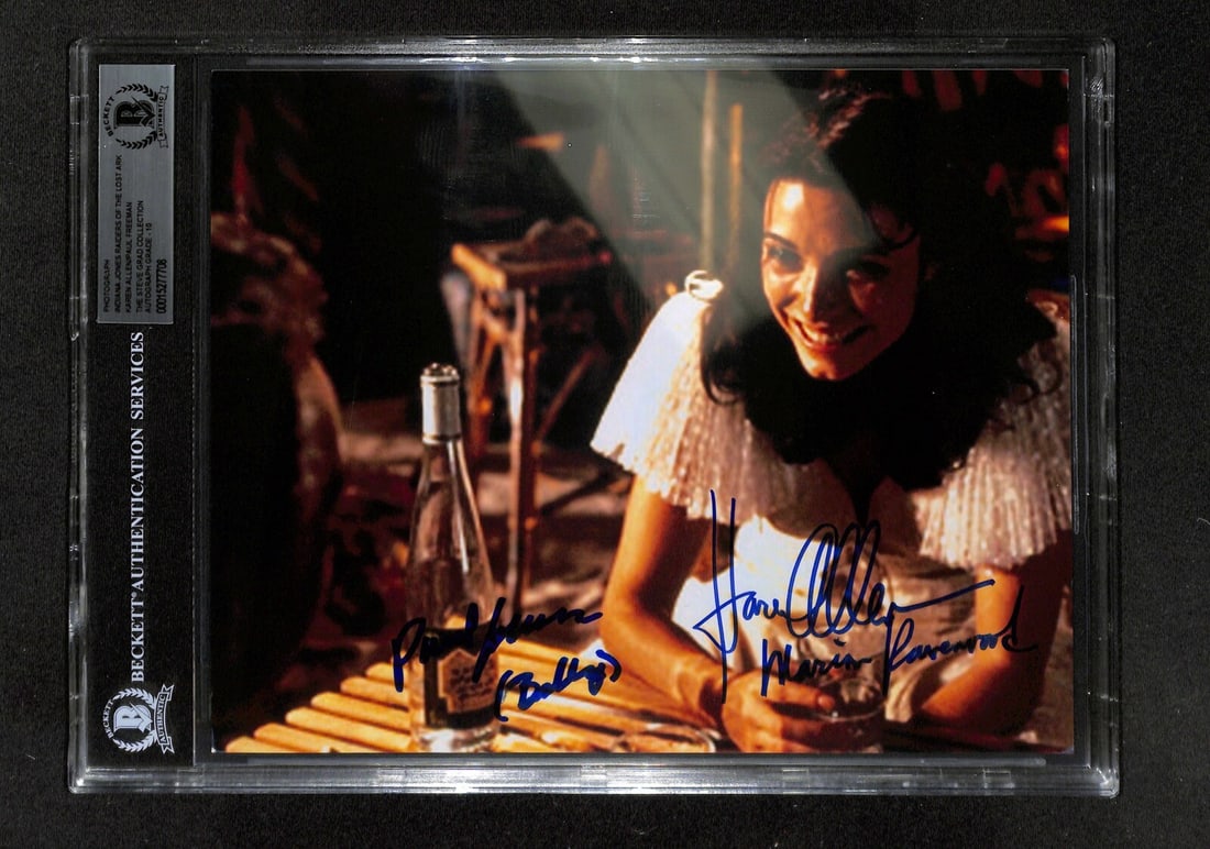 Karen Allen Paul Freeman Signed 8x10 Photo Raiders BAS 10: Karen Allen Paul Freeman Signed 8x10 Photo Raiders BAS 10 This is an autographed 8x10 color photograph featuring Karen Allen as Marion Ravenwood and Paul Freeman as Rene Belloq from the iconic film Ra