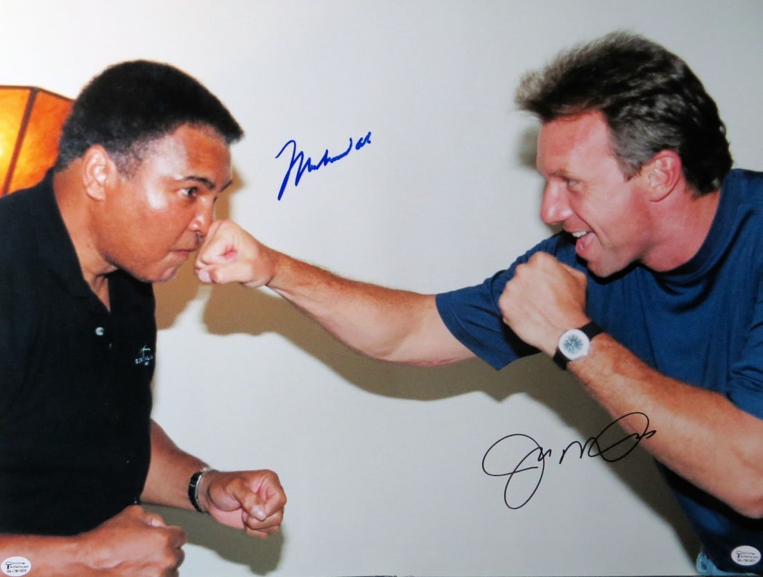 Muhammad Ali Joe Montana Signed 16x20 Photo JSA Authenticated: Muhammad Ali Joe Montana Signed 16x20 Photo JSA Authenticated This remarkable 16x20 photo features the legendary Muhammad Ali and NFL star Joe Montana in a striking punch pose, capturing the essence o