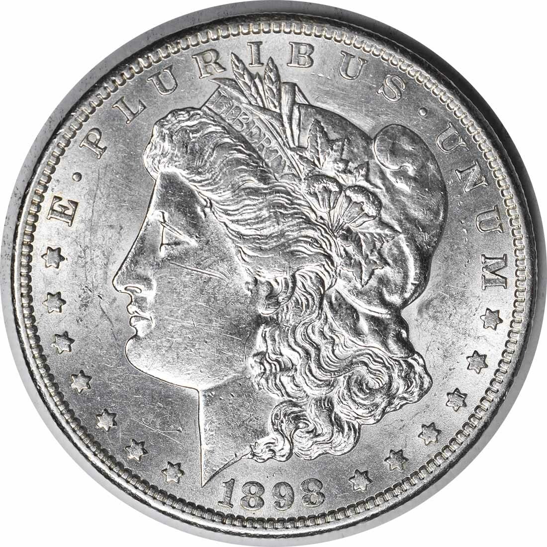 AU Grade 1898 San Francisco Morgan Silver Dollar Uncertified: AU Grade 1898 San Francisco Morgan Silver Dollar Uncertified This is an 1898-S Morgan Silver Dollar from the San Francisco Mint. Designed by George T. Morgan, this coin is composed of 90% silver and 1