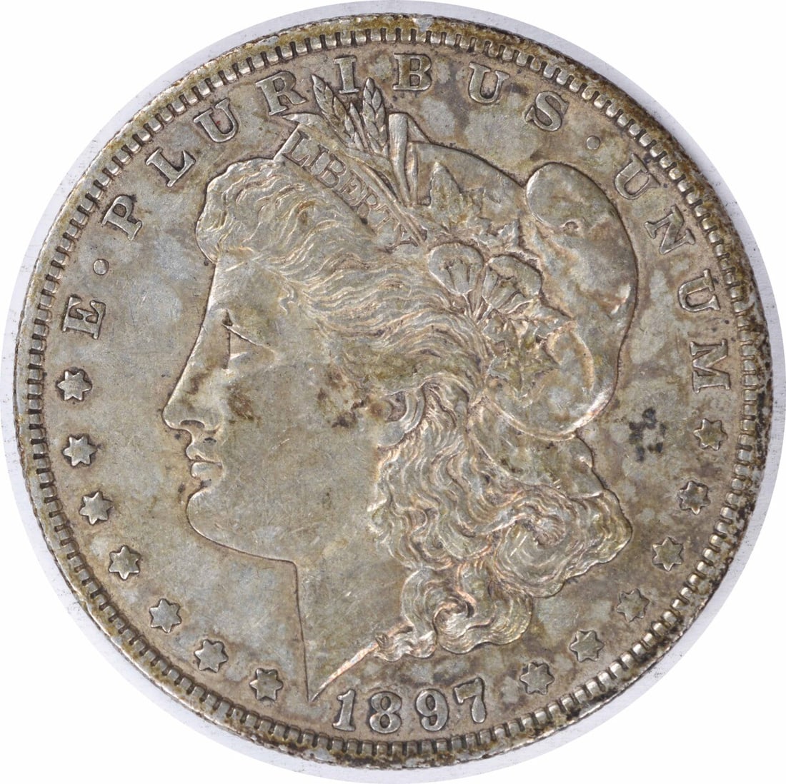 1897-O Morgan Silver Dollar Uncertified 90% Silver XF Coin: 1897-O Morgan Silver Dollar Uncertified 90% Silver XF Coin This 1897-O Morgan Silver Dollar is a remarkable piece from the New Orleans Mint, featuring a classic design by George T. Morgan. Made of 90%
