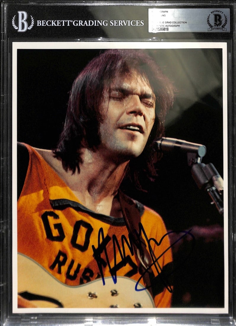 Neil Young Signed 8x10 Photo Authenticated by Beckett Slabbed: Neil Young Signed 8x10 Photo Authenticated by Beckett Slabbed This is an original 8x10 color photograph autographed in blue permanent marker by musician Neil Young. The signature was obtained in perso