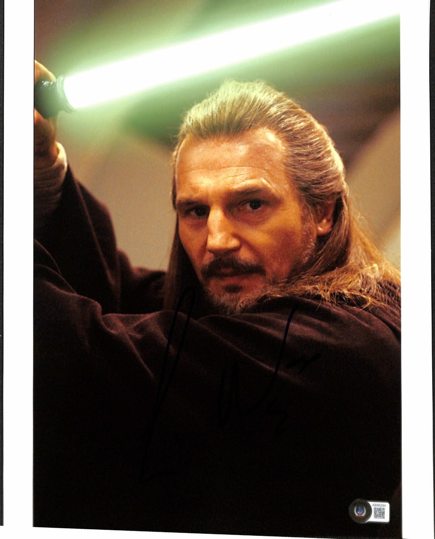 11x14 Star Wars Qui-Gon Jinn Photo Signed by Liam Neeson Beckett Authenticated: 11x14 Star Wars Qui-Gon Jinn Photo Signed by Liam Neeson Beckett Authenticated This is an original 11x14 color photograph autographed by Liam Neeson, who portrayed Qui-Gon Jinn in Star Wars: The Phant