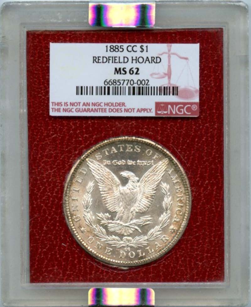 1885-CC Morgan Silver Dollar NGC MS62 Redfield Hoard Uncirculated: 1885-CC Morgan Silver Dollar NGC MS62 Redfield Hoard Uncirculated This 1885-CC Morgan Silver Dollar is a stunning example from the Redfield Hoard, certified by NGC with a grade of MS62. Minted in Cars