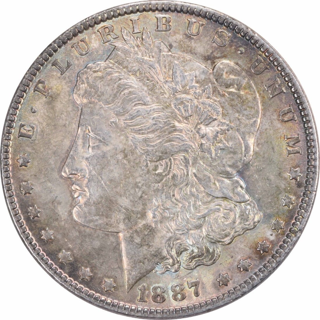 1887 Morgan Silver Dollar Choice BU Toned Uncertified: 1887 Morgan Silver Dollar Choice BU Toned Uncertified This 1887 Morgan Silver Dollar is a stunning example of numismatic artistry, featuring a beautiful choice BU (Brilliant Uncirculated) condition. T