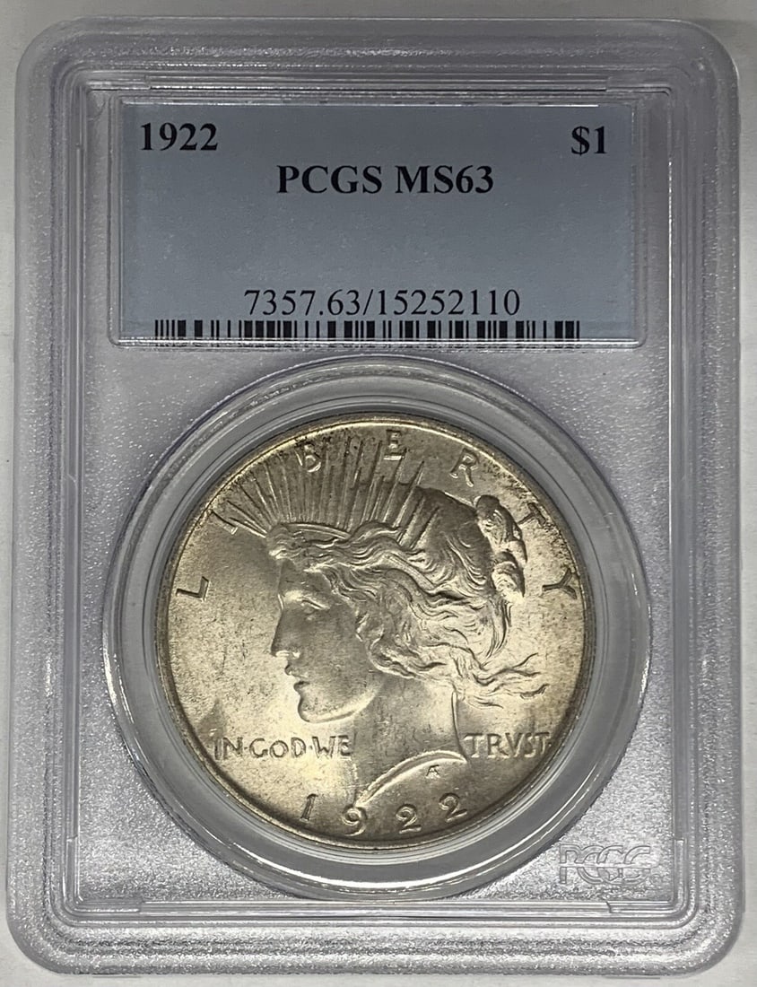 1922 PCGS MS 63 Peace Dollar Silver Coin Lightly Toned: 1922 PCGS MS 63 Peace Dollar Silver Coin Lightly Toned This 1922 Peace Silver Dollar features a lightly toned finish and has been graded MS 63 by PCGS. It is an uncirculated coin composed of silver an