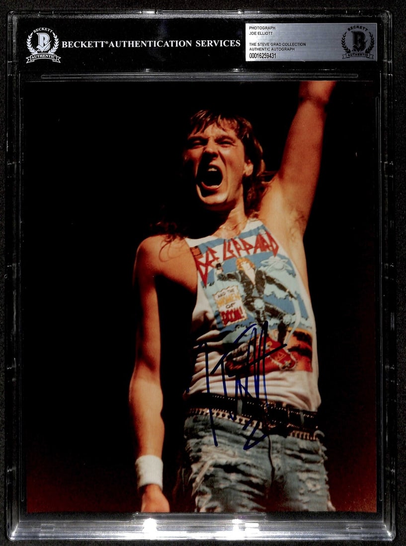 Autographed 8x10 Photo of Joe Elliott Lead Singer of Def Leppard Beckett Authenticated: Autographed 8x10 Photo of Joe Elliott Lead Singer of Def Leppard Beckett Authenticated This is an original 8x10 photograph autographed by Joe Elliott, the lead singer and founding member of Def Leppar