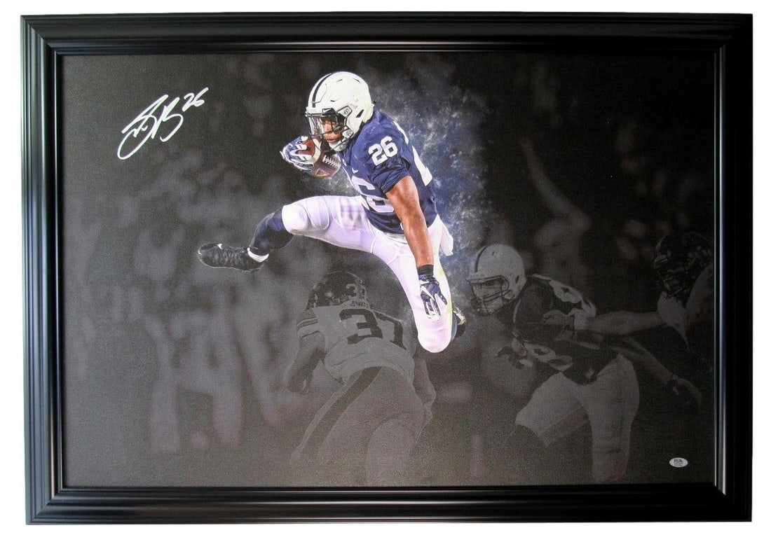 Framed 24x36 Canvas Photo Signed by Saquon Barkley PSA DNA Authenticated: Framed 24x36 Canvas Photo Signed by Saquon Barkley PSA DNA Authenticated Celebrate your fandom with this stunning 24" x 36" framed canvas photo, personally signed by NFL star Saquon Barkley. This coll
