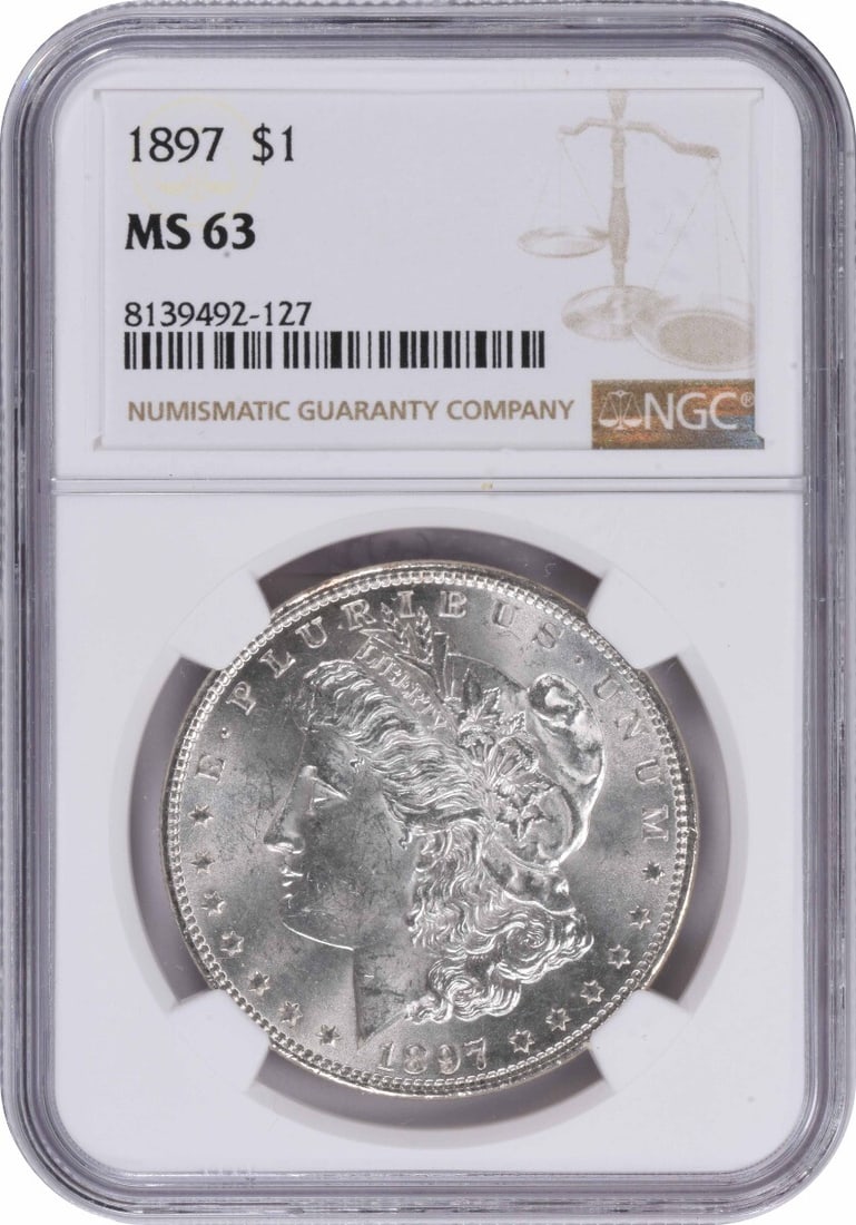 MS63 NGC 1897 Morgan Dollar Uncirculated Philadelphia Silver Coin: MS63 NGC 1897 Morgan Dollar Uncirculated Philadelphia Silver Coin This 1897 Morgan Silver Dollar, graded MS63 by NGC, is an uncirculated coin from the United States. Struck in Philadelphia with no min