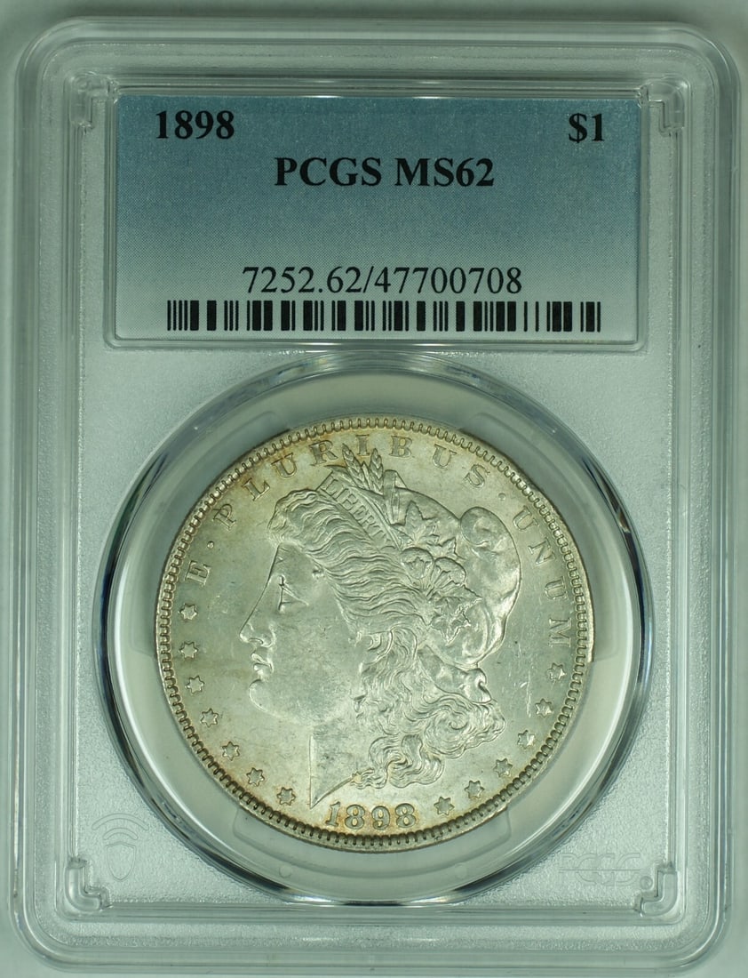 PCGS MS 62 1898 Morgan Silver Dollar Certified Uncirculated Coin: PCGS MS 62 1898 Morgan Silver Dollar Certified Uncirculated Coin This 1898 Morgan Silver Dollar coin is certified by PCGS with a grade of MS 62. It is uncirculated and features a composition of silver