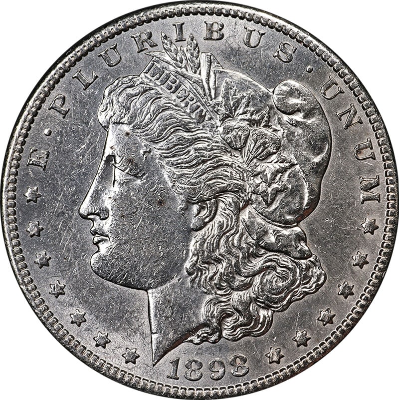 1898-S Morgan Silver Dollar 90% Silver Nice AU/BU Eye Appeal: 1898-S Morgan Silver Dollar 90% Silver Nice AU/BU Eye Appeal This stunning 1898-S Morgan Silver Dollar showcases exceptional eye appeal, featuring bright white luster and a well-defined strike. Graded