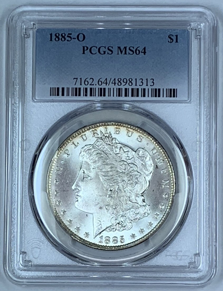 PCGS MS 64 1885-O Morgan Silver Dollar Uncirculated US Coin: PCGS MS 64 1885-O Morgan Silver Dollar Uncirculated US Coin This is an 1885-O Morgan Silver Dollar coin graded MS 64 by PCGS. Struck in the United States, this uncirculated silver coin features the cl
