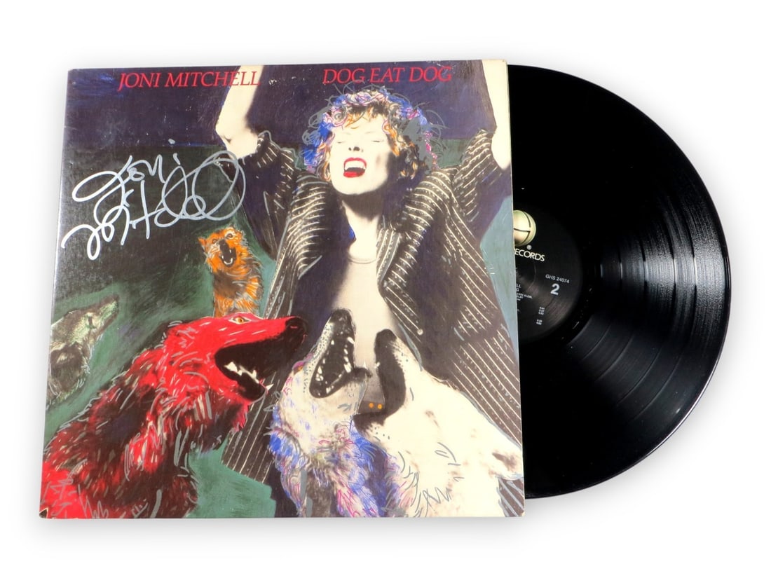 Joni Mitchell Autographed Album Cover Dog Eat Dog Beckett Authenticated: Joni Mitchell Autographed Album Cover Dog Eat Dog Beckett Authenticated This Joni Mitchell autographed record album cover features the iconic artist's signature, authenticated by Beckett Authenticatio