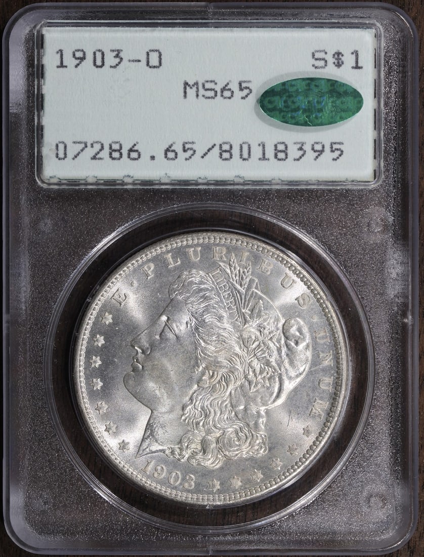 1903-O Morgan Silver Dollar MS65 CAC PCGS Rattler KEY Date: 1903-O Morgan Silver Dollar MS65 CAC PCGS Rattler KEY Date This 1903-O Morgan Silver Dollar is a remarkable piece for collectors, featuring an uncirculated grade of MS 65 as certified by PCGS. Struck