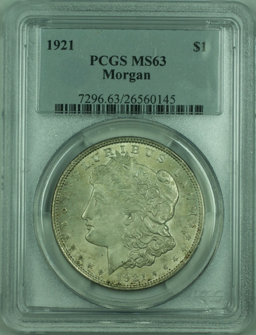 1921 Silver Morgan Dollar Graded MS-63 by PCGS $1 Coin: 1921 Silver Morgan Dollar Graded MS-63 by PCGS $1 Coin This is a 1921 Morgan Silver Dollar $1 coin certified by PCGS with a grade of MS-63. Minted in Philadelphia, the coin is composed of silver with