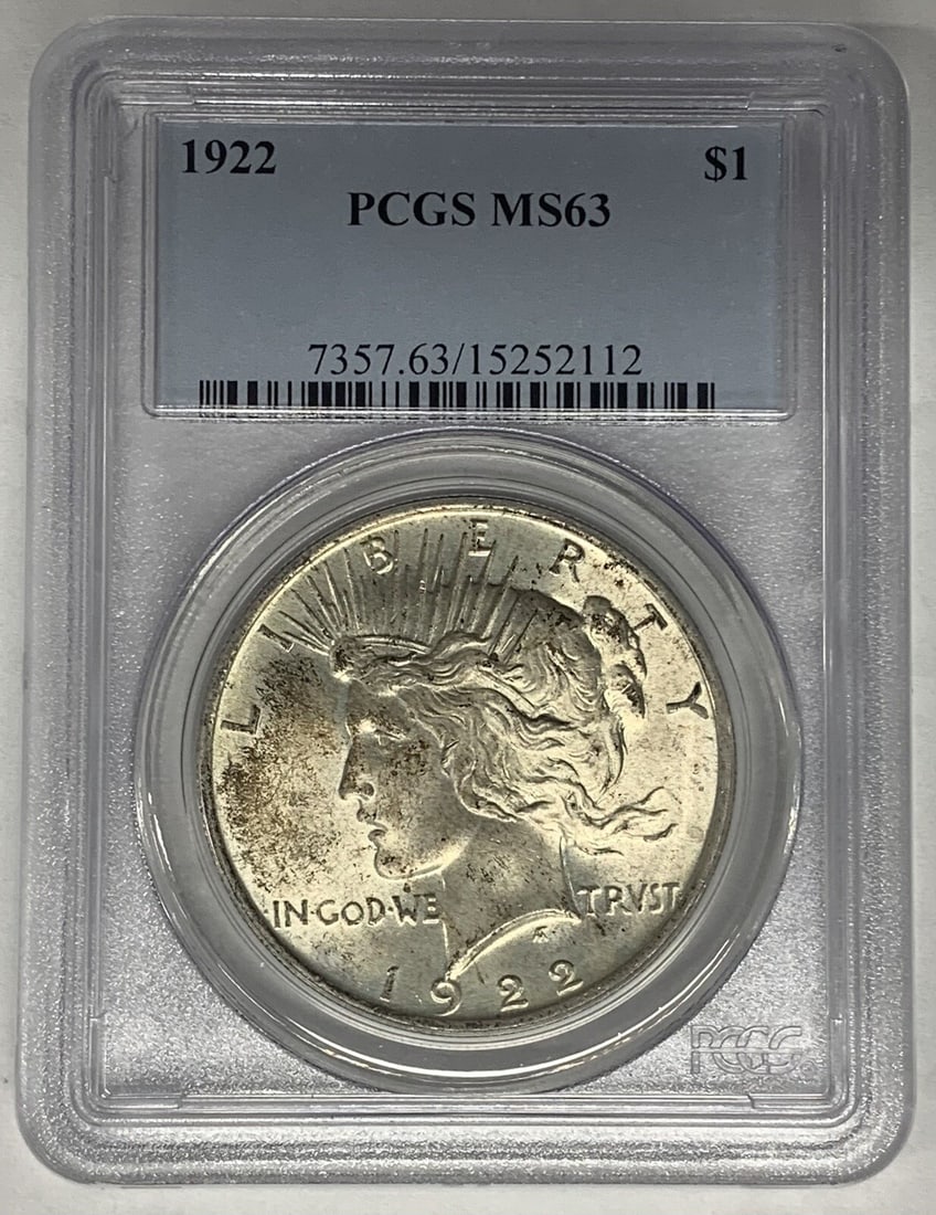 1922 Peace Dollar Silver Coin PCGS Certified MS 63 Light Toning: 1922 Peace Dollar Silver Coin PCGS Certified MS 63 Light Toning This 1922 Peace Silver Dollar coin is a lightly toned uncirculated example certified by PCGS with a grade of MS 63. Struck in silver, it