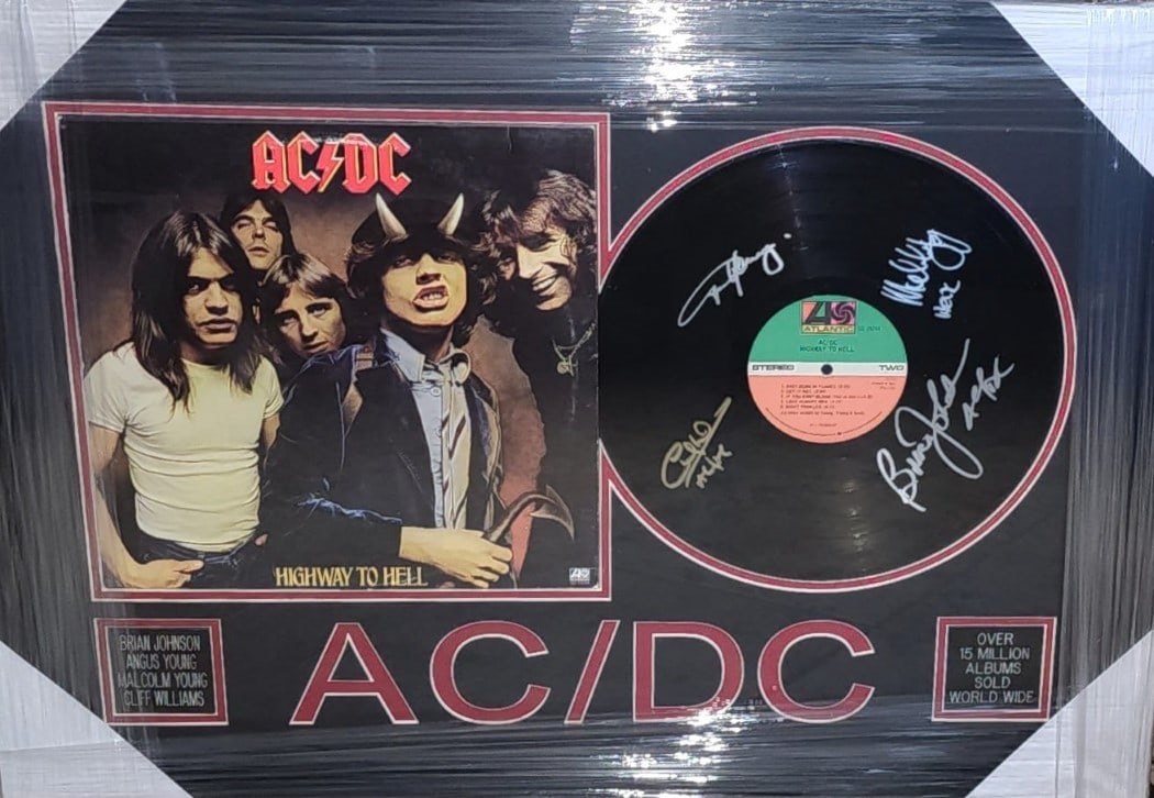 AC/DC Signed Highway To Hell Vinyl Record Framed JSA Authenticated: AC/DC Signed Highway To Hell Vinyl Record Framed JSA Authenticated Celebrate the legendary rock band AC/DC with this autographed "Highway To Hell" vinyl record. This original record features the signa