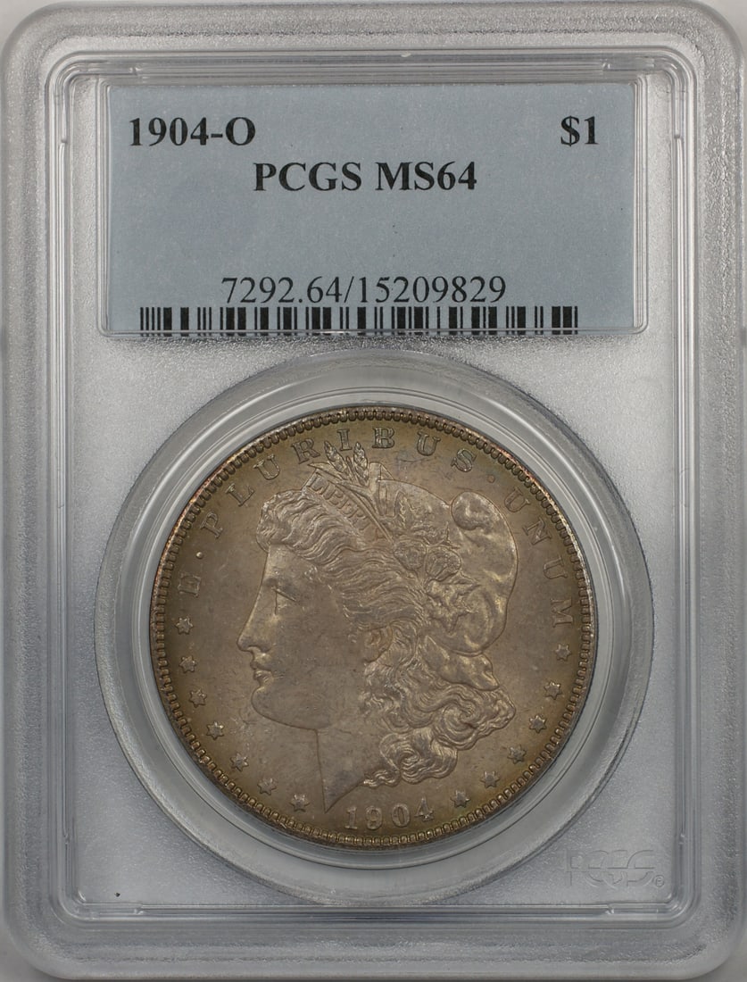 PCGS MS-64 Graded 1904-O Morgan Dollar Silver Coin From New Orleans Mint: PCGS MS-64 Graded 1904-O Morgan Dollar Silver Coin From New Orleans Mint This 1904-O Morgan Silver Dollar is an uncirculated coin graded MS-64 by PCGS. Minted in New Orleans, it features a silver comp