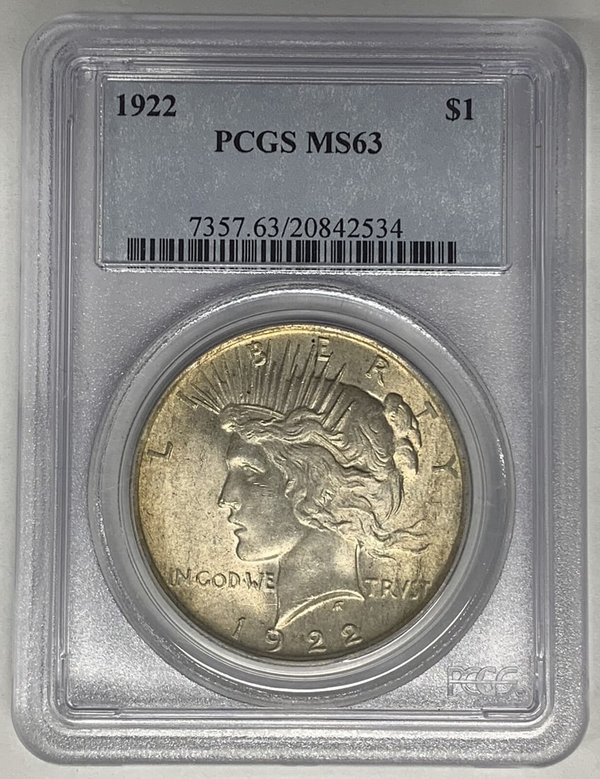 PCGS MS 63 1922 Peace Dollar Silver Coin with Attractive Toning: PCGS MS 63 1922 Peace Dollar Silver Coin with Attractive Toning This is a 1922 Peace Silver Dollar coin from the United States, featuring attractive toning. The coin is composed of silver and has been