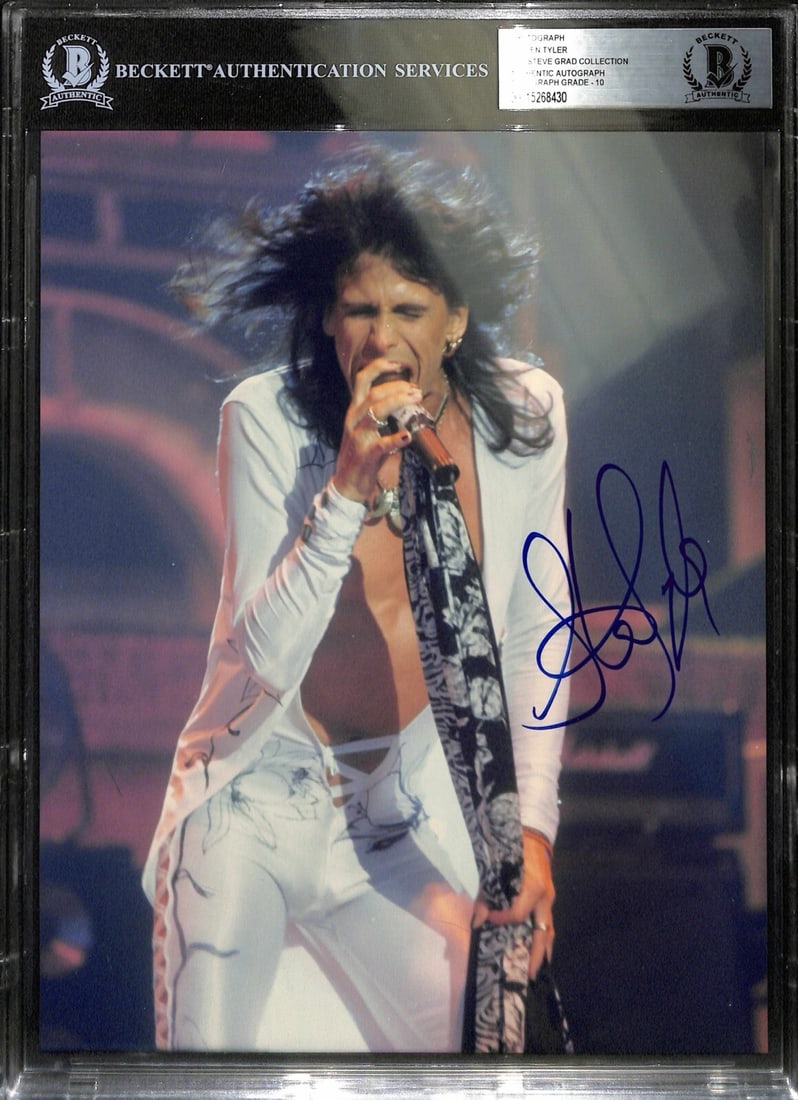 Steven Tyler Signed 8x10 Photo Auto Grade 10 Beckett: Steven Tyler Signed 8x10 Photo Auto Grade 10 Beckett This is an autographed 8x10 color photograph of Steven Tyler, the legendary frontman of Aerosmith. Signed in blue permanent marker, this original p