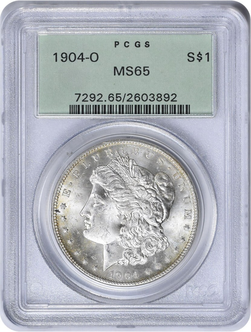 1904-O Morgan Silver Dollar MS65 PCGS Uncirculated 90% Silver: 1904-O Morgan Silver Dollar MS65 PCGS Uncirculated 90% Silver This 1904-O Morgan Silver Dollar is a stunning example of numismatic craftsmanship, graded MS65 by PCGS. Featuring a composition of 90% si