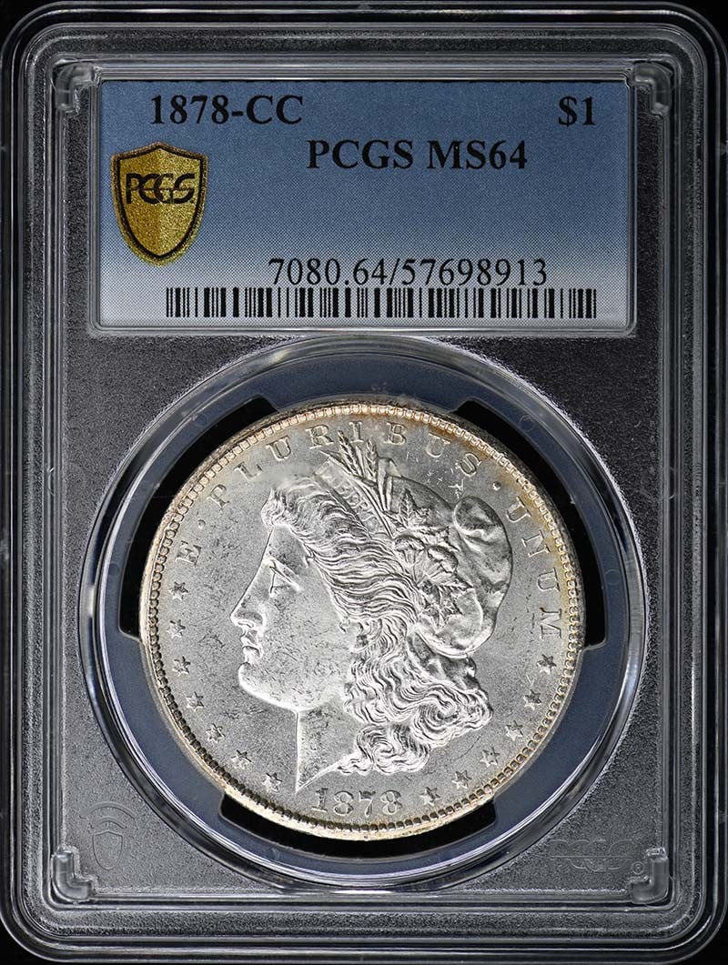 1878-CC Morgan Dollar PCGS MS64 Uncirculated Coin: 1878-CC Morgan Dollar PCGS MS64 Uncirculated Coin This 1878-CC Morgan Dollar is a stunning piece of numismatic history, certified by PCGS with a grade of MS64, indicating its exceptional uncirculated