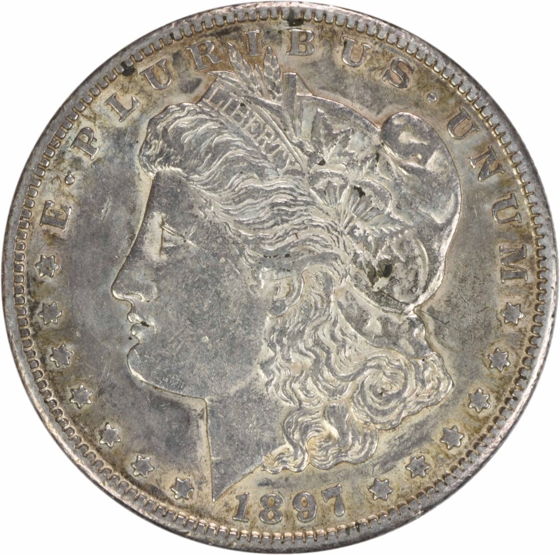 1897-S Morgan Silver Dollar AU 90% Silver San Francisco Mint: 1897-S Morgan Silver Dollar AU 90% Silver San Francisco Mint This 1897-S Morgan Silver Dollar is a beautifully circulated coin, showcasing the craftsmanship of designer George T. Morgan. With a compos