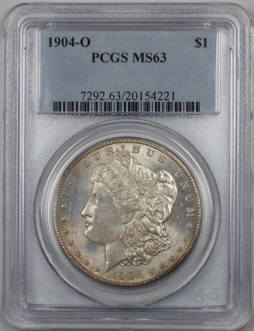 PCGS MS 63 1904-O Morgan Silver Dollar Toned Uncirculated New Orleans Mint: PCGS MS 63 1904-O Morgan Silver Dollar Toned Uncirculated New Orleans Mint This 1904-O Morgan Silver Dollar is an uncirculated coin graded MS-63 by PCGS. Struck at the New Orleans Mint, the coin featu