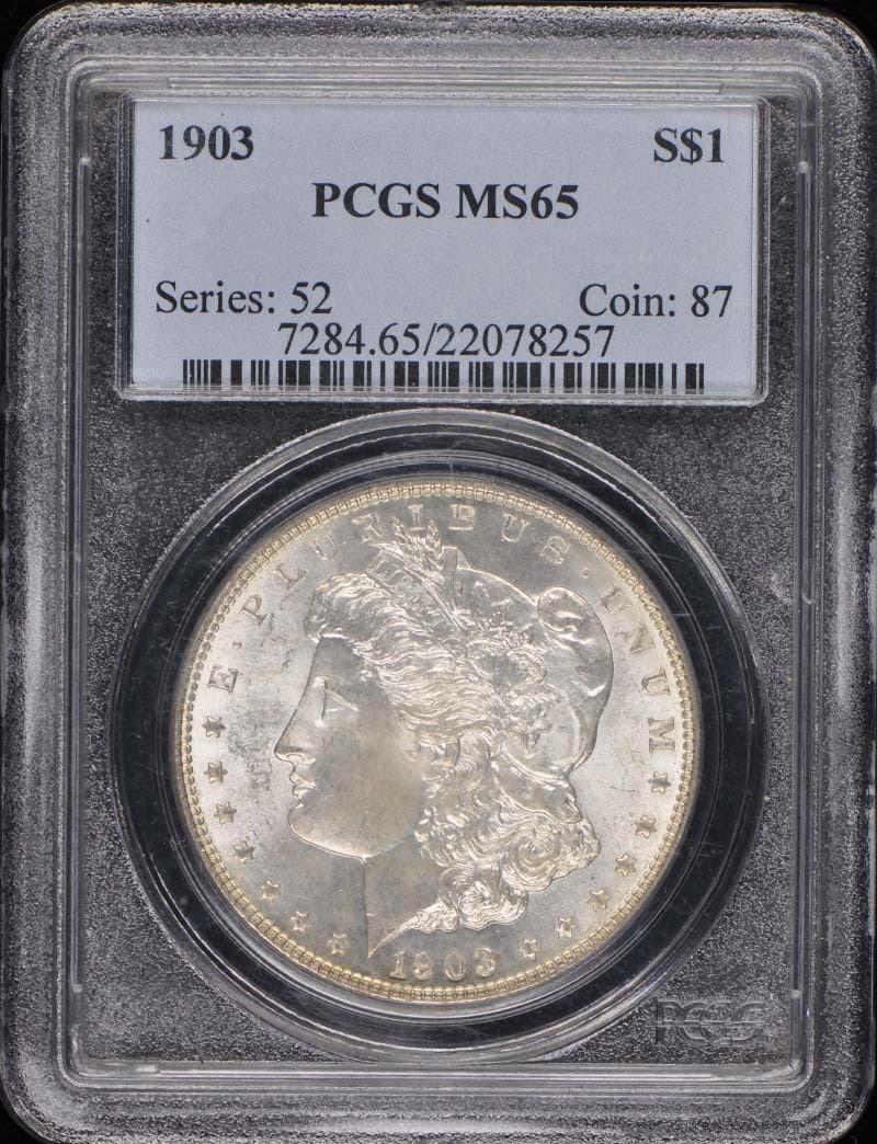 1903 Morgan Dollar PCGS MS65 Uncirculated Philadelphia Coin: 1903 Morgan Dollar PCGS MS65 Uncirculated Philadelphia Coin This 1903 $1 Morgan Dollar is certified by PCGS, boasting a high grade of MS65. It is in uncirculated condition, ensuring its pristine quali