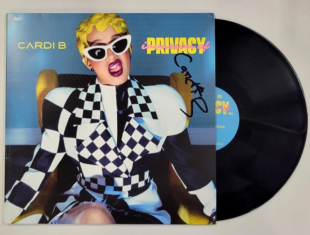 Cardi B Invasion of Privacy Signed Vinyl Album Beckett Authenticated: Cardi B Invasion of Privacy Signed Vinyl Album Beckett Authenticated This is an original vinyl album cover of Cardi B's 'Invasion of Privacy,' featuring her autograph. The signature has been authentic