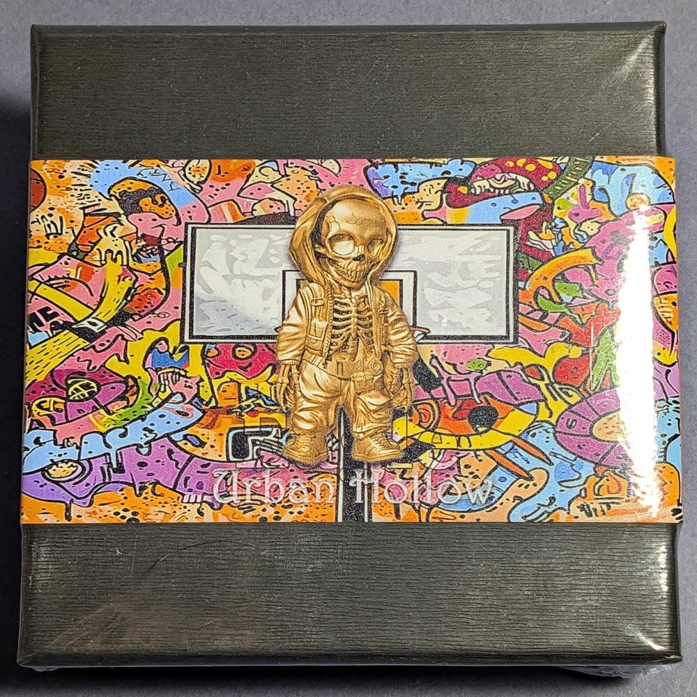 2025 2 Ounce Silver 2000 Franc Cameroon Coin Urban Hollow Gold Gilt Uncirculated: 2025 2 Ounce Silver 2000 Franc Cameroon Coin Urban Hollow Gold Gilt Uncirculated This 2025 Cameroon 2 Ounce Silver 2000 Francs coin features an 'Urban Hollow' design with a gold gilt finish. The coin