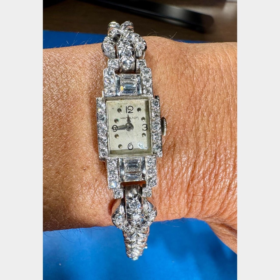 HAMILTON Art Deco Platinum Diamond Cocktail Watch 4.40 Ct: HAMILTON Art Deco Platinum Diamond Cocktail Watch 4.40 Ct This exquisite HAMILTON Art Deco ladies cocktail watch showcases a stunning design in platinum, weighing 42.5 grams. It is adorned with a tota