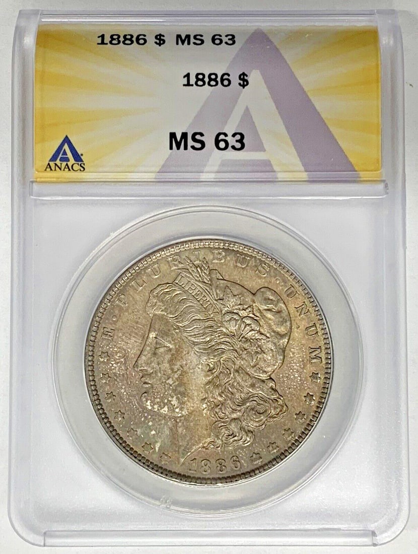 1886 Silver Morgan Dollar ANACS MS 63 Certified Toned Uncirculated Coin: 1886 Silver Morgan Dollar ANACS MS 63 Certified Toned Uncirculated Coin This is an 1886 Morgan Silver Dollar coin from the United States. The coin is composed of silver and features attractive toning.